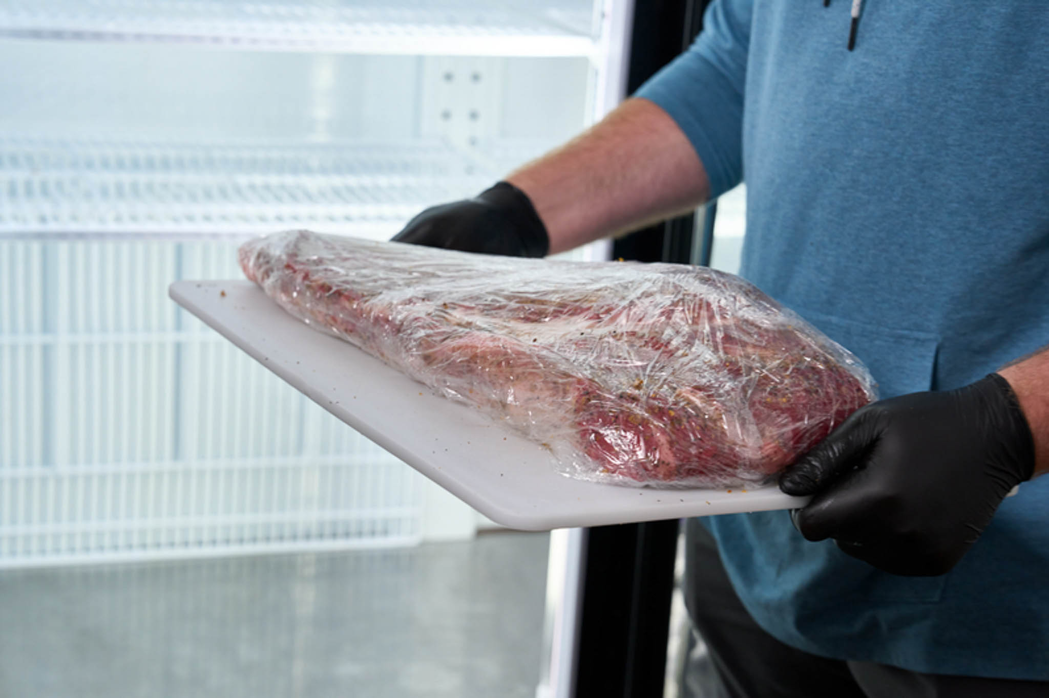 Plastic-wrapped brisket