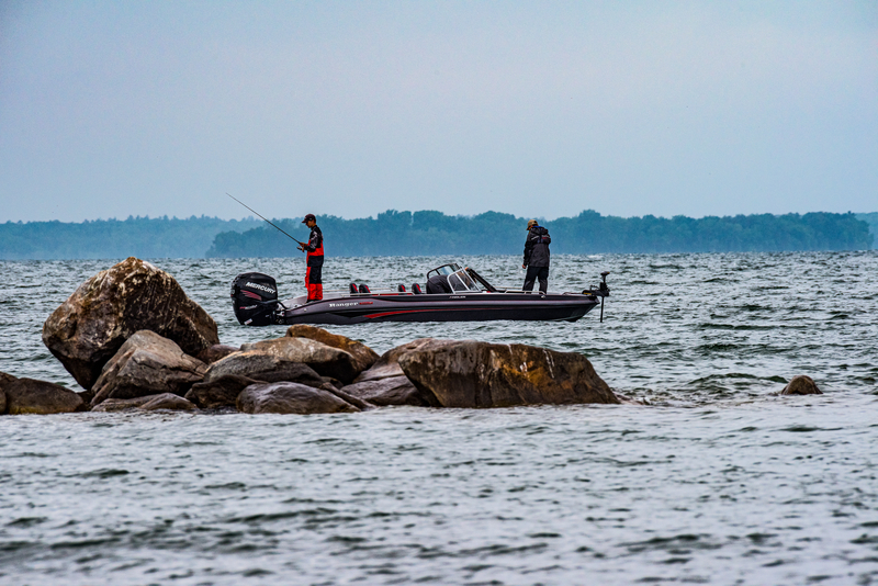 walleye anglers fishing from boat around nearshore structure