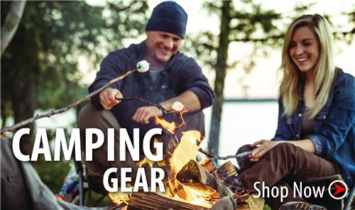Man and woman roasting marshmellows over fire. Click to shop camping gear