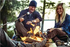 couple campfire water fall