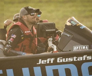 Jeff Gustafson driving boat