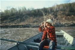 hunter in boat binoculars 250