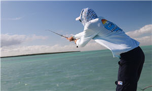 Angler making long casts for dead-boat tactics to batch bonefish