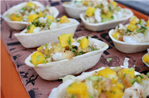Fish taco boats filled and lined up 