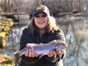Lady trout anlgler holding her catch