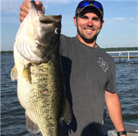 Bass Angler on Lake Fort with a big largemouth bass
