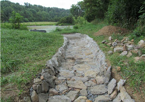 Pond rock spillway