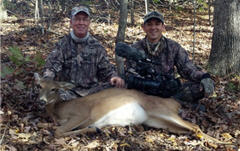 Hunters In The Woods With Deer
