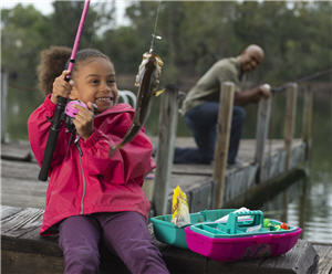 Little girl shore fishing