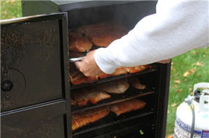 A removing meat from a smoker