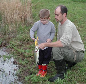 teaching kids to handle fish