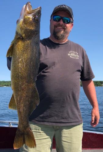 Angler with large walleye