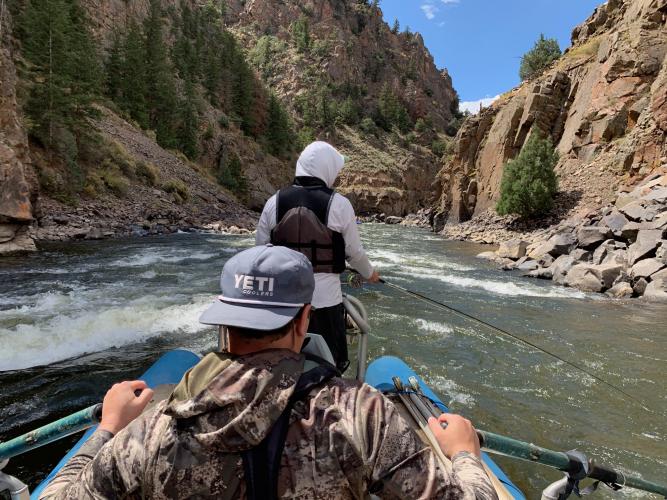 Boater oaring the Colorado river rapids