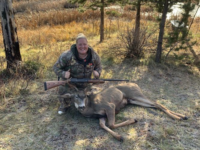 Proud lady hunter with her first buck