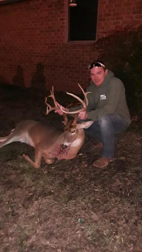 Deer hunter with a Tennessee whitetail buck