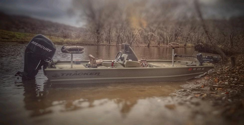 Tracker jon boat on the river shore