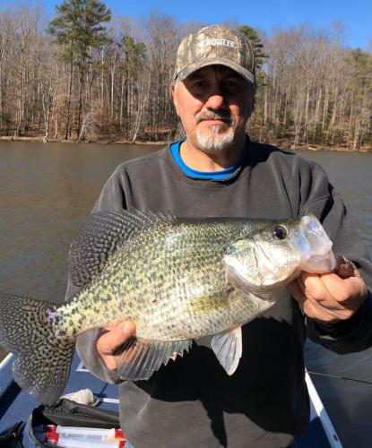 Crappie angler holding a large crappie fish