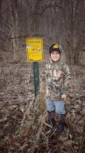 Young boy hiking on public land