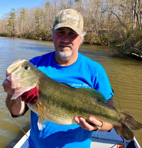 Bass angler holding a Trophy Bass - 9lb