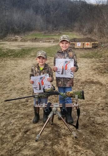 Two young hunters target shooting practice before turkey hunt
