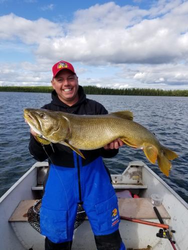Wes David holding a large walleye fish