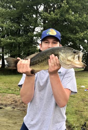 Angler holding a 5 lb Bass