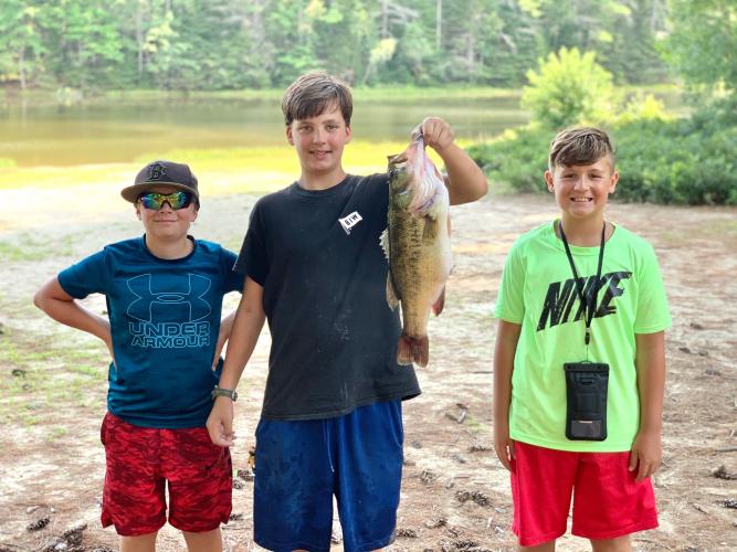3 boys one with a bass