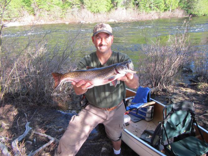 Angler with good Sized Brown Trout