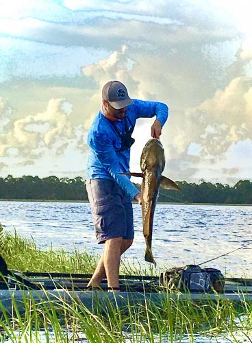 Kayak angler with fish