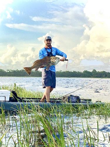 Angler with large redfish