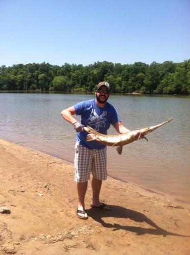angler holding Longnose gar