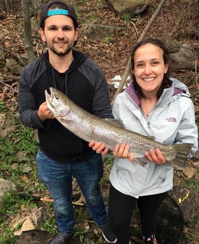 couple holding trout