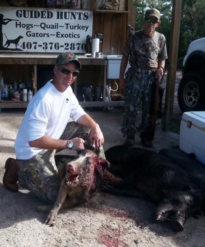 Braggin' Board Photo: Larry Sweeney and Phil Skeen Hog Hunting