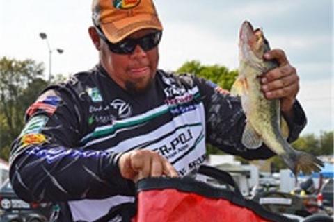 Bass Pro Shops pro Scott Martin with a pair of chunky spotted bass ...