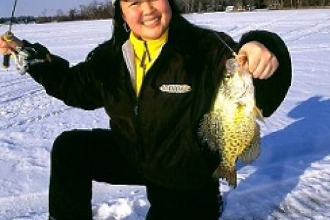 Kristi Takasaki with a beautiful crappie caught in bright sunshine, but with a glow jig by Kristi Takasaki with a beautiful crappie caught in bright sunshine, but with a glow jig...
