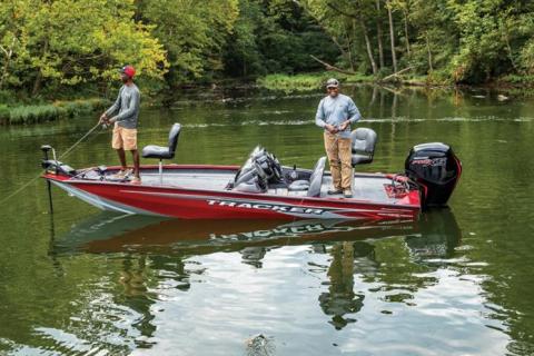 Two men fishing from a Tracker boat in a quiet cover on the lake