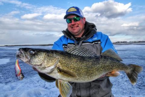 Kayak Fisherman Hooks Monster Pike On Topwater Duck Lure In North Dakota