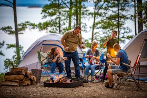 Family making smores during a campout