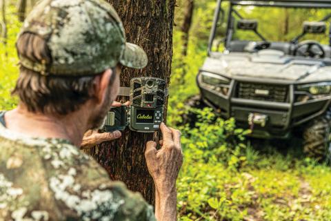 Hunter setting up Cabela's trail camera