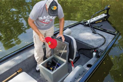 angler looking through boat storage