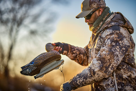 Hunter wearing layered clothing while hunting for waterfowl