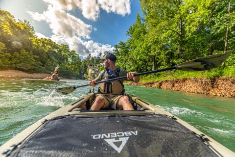 kayaker in ascend kayak on river