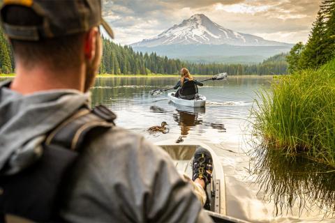 Couple in two kayak on a lake