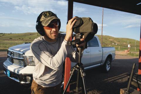 Shooter at shooting range wearing shooting glasses