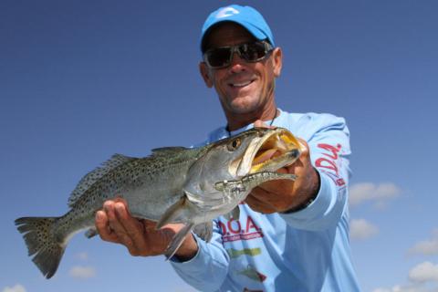 Seat Trout angler holding his catch. photo by D. Brown