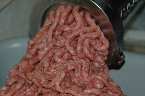 Grinding venision meat