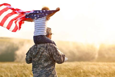 Veteran Celebrating America with Child