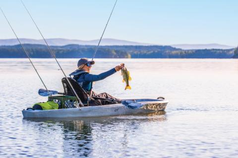 Kayak angler catches  largemouth bass