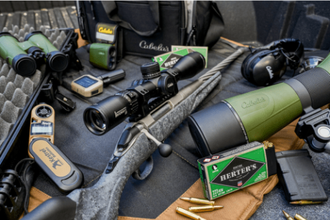 Rifle on display with high powered scopes and other optics. 