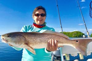 Angler with Red Drum fish